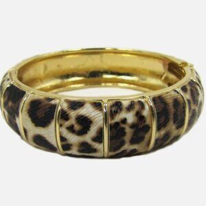 Animal print pattern bangle bracelet with spring back hinge opening.